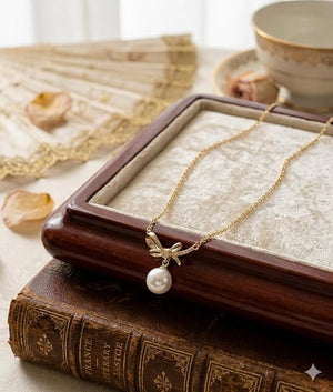 Niluk Gold-Plated Bow Design Pendant Necklace with Pearl Drop