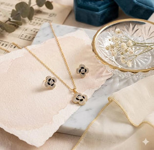 Niluk Elegant Gold-Tone Floral Pendant Necklace & Stud Earrings Set with Sparkling Stones and Black Enamel Detailing