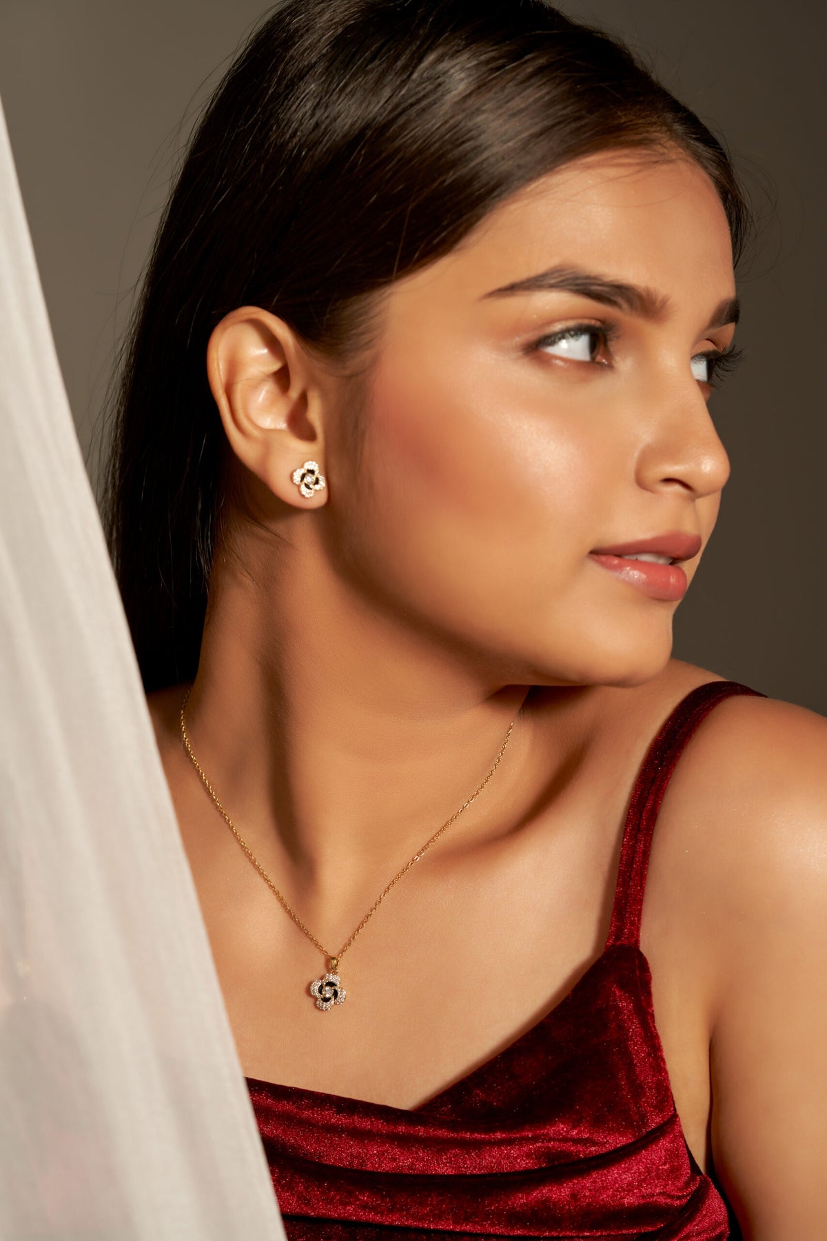 Niluk elegant gold tone floral pendant necklace & stud earrings set with sparkling stones and black enamel detailing