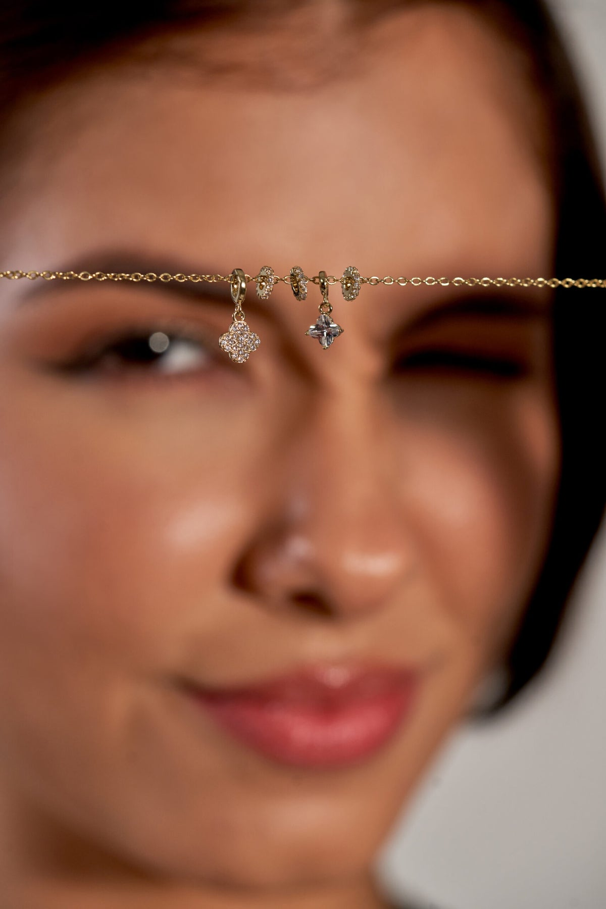 Niluk gold plated butterfly & star charm necklace